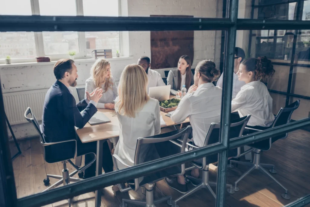 Management teams discuss employee performance