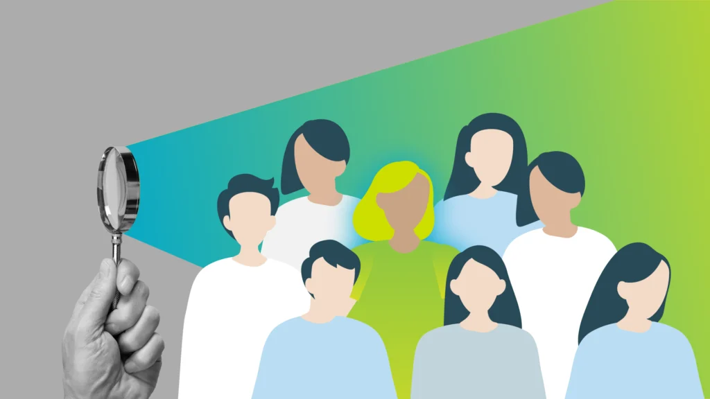 Illustration of a group of sales people through a magnifying glass